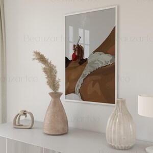 May include: A framed illustration of a person in a white and brown outfit, with a red accent, holding a cigarette. The illustration is set against a gray background with a window in the background.
