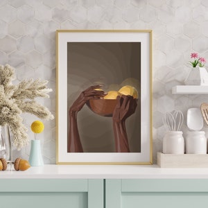 May include: A framed print of a pair of hands holding a wooden bowl filled with yellow fruit. The background is a muted brown color.