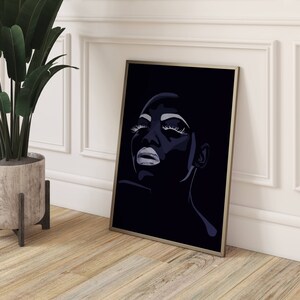 May include: A black and white digital art print of a woman's face with dramatic makeup. The woman's eyes are closed and her lips are slightly parted. The background is black.