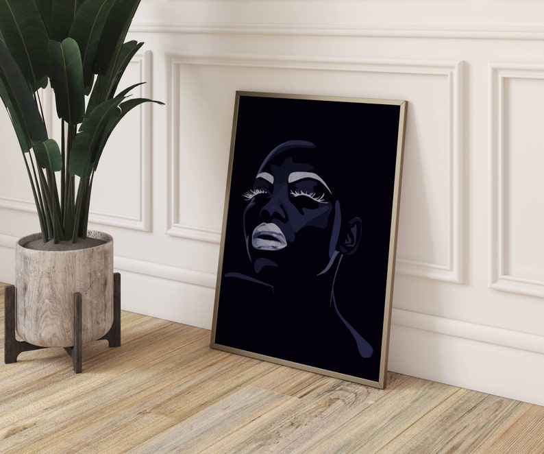 May include: A black and white digital art print of a woman's face with dramatic makeup. The woman's eyes are closed and her lips are slightly parted. The background is black.
