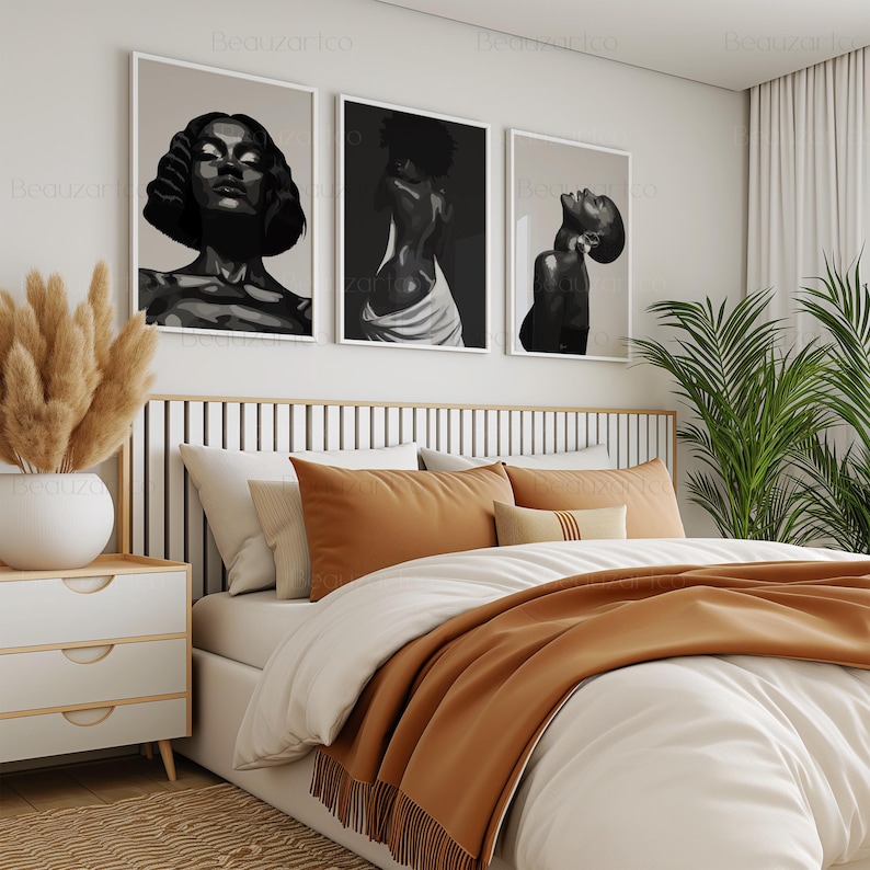 May include: Three black and white line art prints of women with different hairstyles and poses hanging on a white wall above a bed with a brown headboard and a white and brown bedding set.