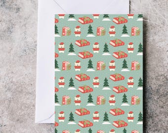 May include: A Christmas-themed greeting card with a repeating pattern of festive elements. The pattern includes red wrapped gifts, snow-covered Christmas trees, and polar bears wearing Santa hats, set against a light teal background. A white envelope is visible.