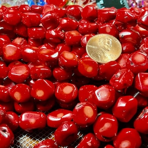 Red coral nuggets. Size approximate 6x10mm. Side drilled 1.5 mm hole. Sold per strand (15 inches) or per Lot (10PCs).