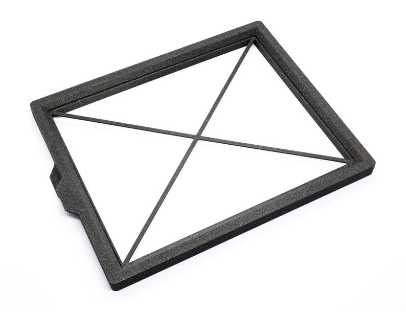 May include: Black foam frame with a grid pattern. The frame is rectangular and has a slightly raised edge.