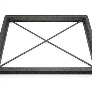 May include: Black foam frame with a criss-cross pattern inside. The frame is designed to protect a delicate object.
