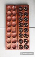 Zanzibari Mancala/Bao board game product logo