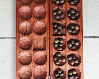 Zanzibari Mancala/Bao board game