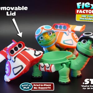May include: A collection of brightly coloured 3D-printed turtle figurines, each sporting a racing theme. The turtles are green with red, white, and orange details. The image includes text that says "Flexi Factory" and "Removable Lid".