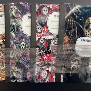 May include: Four composition books featuring horror movie themes. The covers display various iconic characters, including masked figures, clowns, and dolls, set against colorful backgrounds of pumpkins, autumn leaves, and dark, graphic patterns.