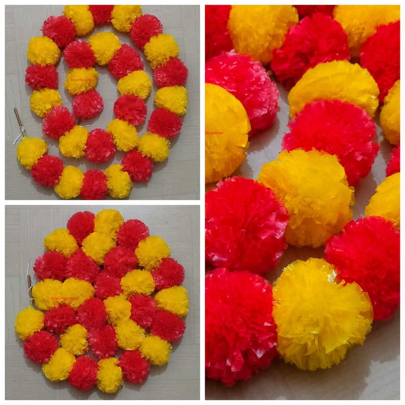 May include: A garland of artificial marigold flowers in yellow and red. The garland is made of paper and is strung together with a thin string. The garland is perfect for decorating for a party or special occasion.
