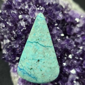 May include: A set of three ceramic mugs with a speckled, matte finish. Each mug features a different color: light blue, cream, and gray. The mugs have a simple, modern design and a comfortable handle. Perfect for coffee or tea.