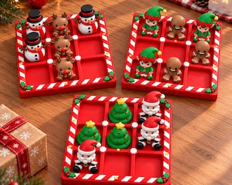 May include: Three square red tic-tac-toe game boards with candy cane striped borders. One board features snowmen and reindeer figures, another has elves and gingerbread men, and the third displays Santa Claus and Christmas tree figures.