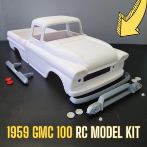 May include: A white 1959 GMC 100 RC model kit. The kit includes the truck body, a front bumper, and other parts. The truck is a classic pickup truck with a long hood and a short bed.