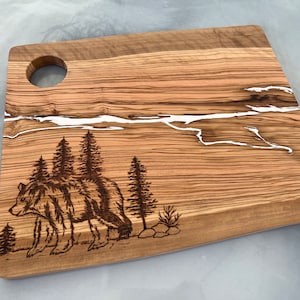 Epoxy Olive wood serving/cutting board with hand burned bear and white epoxy accents