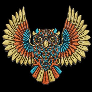 May include: Embroidered owl patch with outstretched wings. The owl features intricate detailing in gold, orange, teal, and blue thread against a black background. The design showcases a symmetrical pattern, perfect for adding to clothing or accessories.