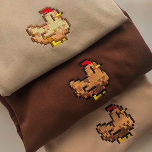 Sudadera con capucha de Stardew Valley con pollo y bordado
