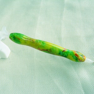 May include: A green, yellow, and red diamond painting pen with a clear plastic tip.