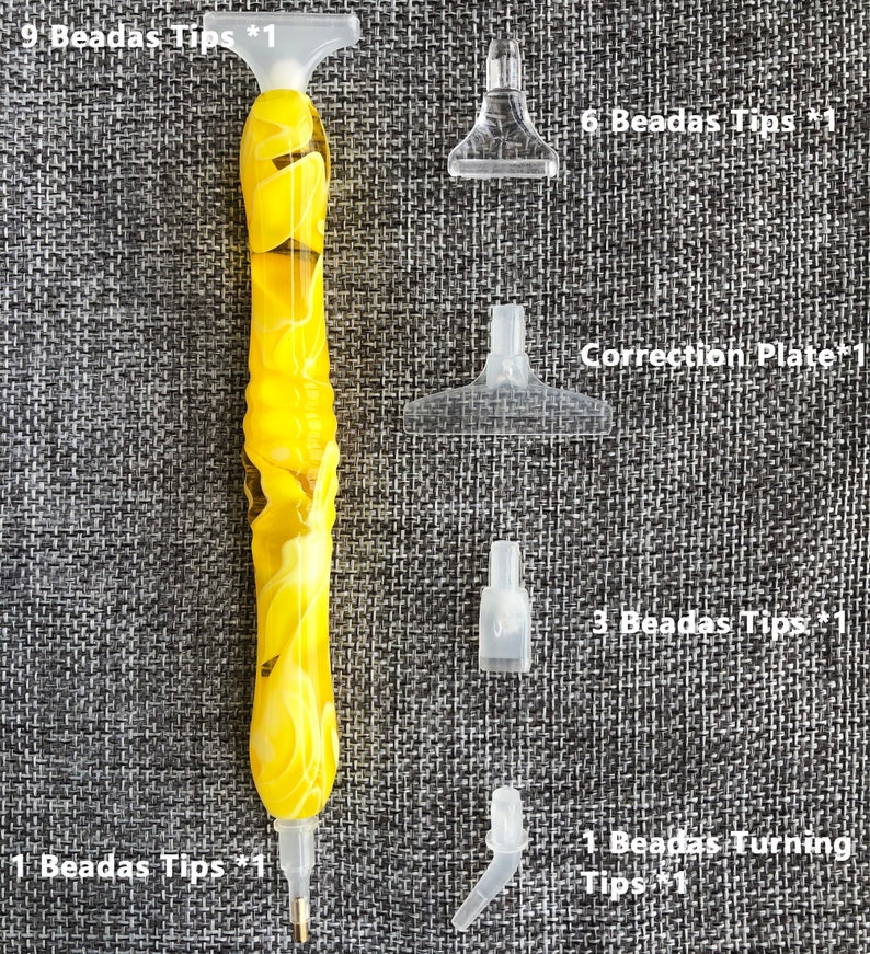 May include: A set of diamond painting tools including a yellow and white pen with nine tips, a correction plate, and six, three, and one bead tips.