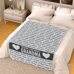 May include: A gray and white blanket with the text "Reasons I love being a Grandma" and a heart design. The text is surrounded by a repeating pattern of names, including Raphael, Gabriel, Miguel, Scarlett, Jessa, and Rache.
