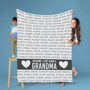 May include: A gray and white throw blanket with a heart design and the text "Reasons I love being a Grandma". The text is surrounded by a list of names, including Raphael, Gabriel, Miguel, Scarlett, Jessa, Rache, and Michael.