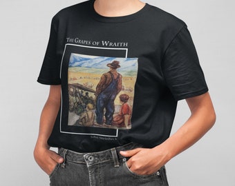 May include: Black t-shirt with a graphic print of a scene from the book "The Grapes of Wrath" by John Steinbeck. The scene depicts two figures standing in a field, one wearing overalls and the other a red dress.