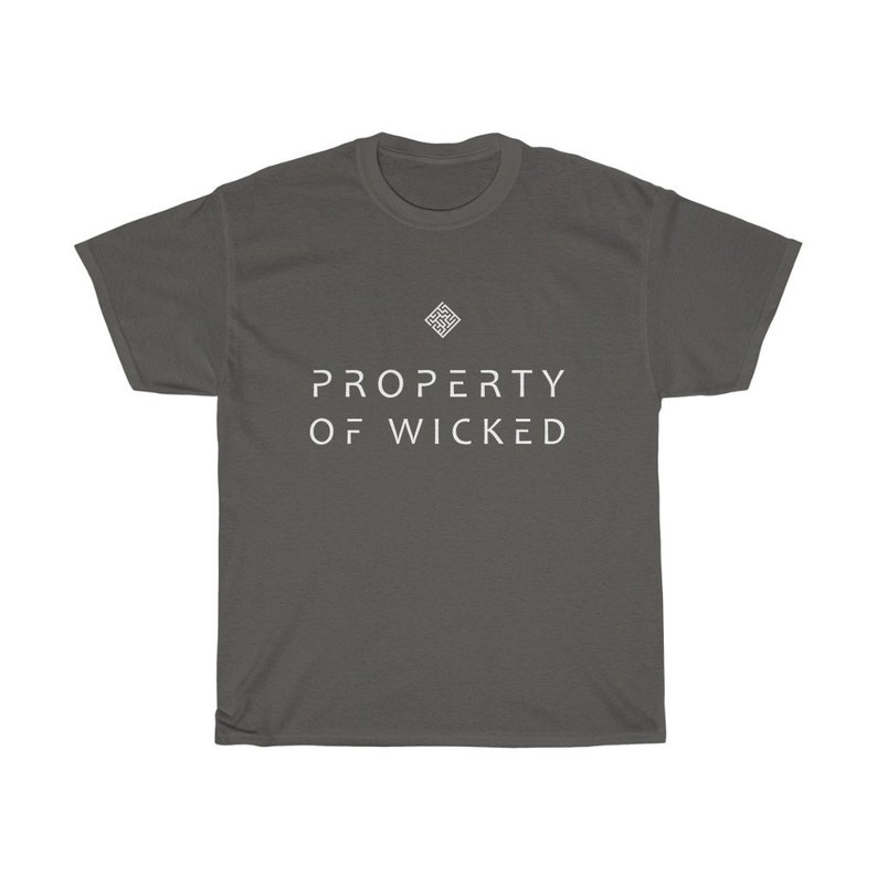 May include: A dark gray t-shirt with a white geometric design and the text "PROPERTY OF WICKED" printed on the front.