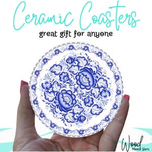 May include: Ceramic coaster with a floral design in shades of blue and white. The coaster is round and features a detailed pattern of flowers and leaves. Text on the image reads "Ceramic Coasters" and "great gift for anyone."