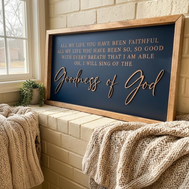 May include: A rectangular wooden sign with a dark blue background and a light brown wooden frame. The sign features the text: ALL MY LIFE YOU HAVE BEEN FAITHFUL ALL MY LIFE YOU HAVE BEEN SO, SO GOOD WITH EVERY BREATH THAT I AM ABLE OH, I WILL SING OF THE Goodness of God.