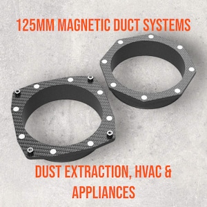 May include: Two black 125mm magnetic duct systems with white dots around the edges. The duct systems are on a gray concrete surface. The text "DUST EXTRACTION, HVAC & APPLIANCES" is below the duct systems.