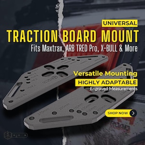May include: Two gray traction board mounts with engraved measurements, designed for versatile mounting. The text reads "Universal Traction Board Mount" and "Fits Maxtrax, ARB TRED Pro, X-BULL & More". The mounts have measurements in inches and millimeters.