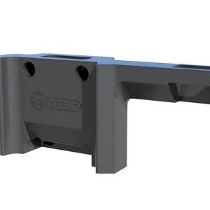 May include: A black plastic 3D printed AR-15 lower receiver with the text "80% Arms" printed on the side.