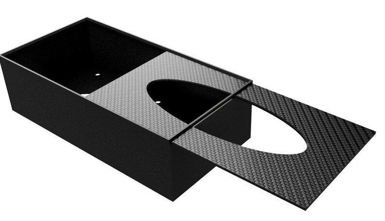 Compact and stylish Carbon Fiber Glove Dispenser, fits standard German sizes, perfect for medical, lab, or kitchen use. Eco-friendly, strong.