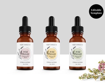 May include: Three amber glass bottles with black dropper tops and white labels. The labels feature a floral design and the text "YOUR CANDLE CO", "Wild Flower Essential Oil Blend", and "2 oz / 60 ml".