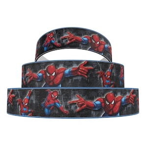 May include: Three rolls of black and red ribbon featuring a repeating pattern of Spiderman in various poses. The ribbon is ideal for adding a superhero touch to crafts, gifts, and decorations.