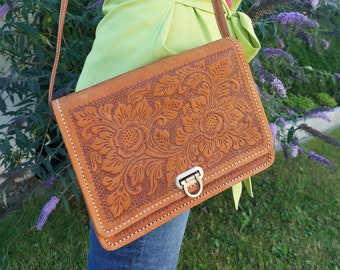 Leather saddle bag with embossed floral pattern and Borobudur image, handmade Indonesian leather bag, women's small crossbody bag