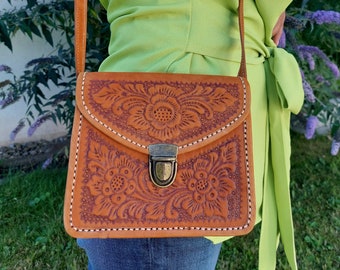 Leather saddle bag with embossed floral pattern, handmade Indonesian leather bag, women's small crossbody purse