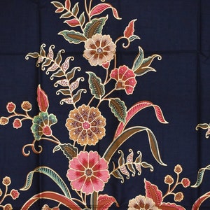 May include: A dark blue fabric with a traditional Indonesian batik pattern featuring intricate floral designs in shades of red, pink, gold, and green.