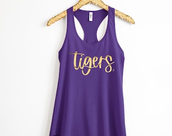 May include: Purple tank top with a gold foil "Tigers" graphic.