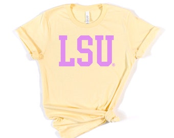 May include: A yellow t-shirt with a purple LSU logo printed on the front.