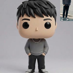 May include: A vinyl figure of a person with black hair, wearing a gray sweater, black pants, and black sneakers with white soles. The figure has a silver chain necklace and is in a standing pose. The figure's head is oversized.