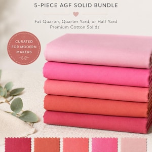 May include: A stack of five fabric bundles in shades of pink and red, labeled "Desert Bloom." The image includes color swatches with names like "Sedona" and "Cactus Flower." The text reads "5-PIECE AGF SOLID BUNDLE" and "CURATED FOR MODERN MAKERS."