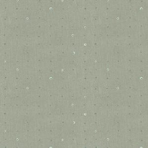 May include: A close-up of a light green fabric with a subtle woven texture. The fabric is dotted with small, evenly spaced, light gray circles and tiny white circles, creating a delicate pattern. The overall effect is soft and understated.