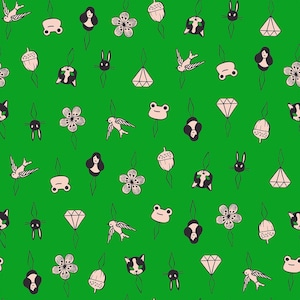 May include: A repeating pattern on a vibrant green background featuring small, hand-drawn style illustrations of birds, frogs, acorns, flowers, diamond shapes, rabbit heads, cat faces, and human silhouettes, each suspended by a thin black line.