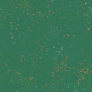 May include: A solid green background with a speckled pattern of small, irregular dots in shades of orange, blue, and white. The dots are scattered across the surface, creating a textured effect.