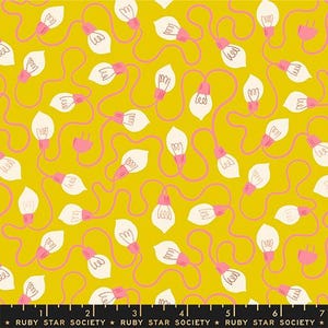 May include: A mustard yellow fabric featuring a repeating pattern of white light bulbs connected by pink electrical cords. The design includes pink electrical plugs and a black selvage edge at the bottom with the text Ruby Star Society.