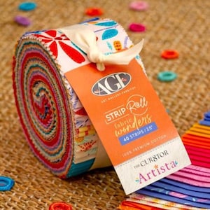 May include: A rolled bundle of fabric strips with a colorful, patterned design. The roll is tied with a cream-colored ribbon and features a tag that reads "Strip Roll Wonders" and "40 Strips/2.5"" with the brand name "Art Gallery Fabrics". The fabric is 100% premium cotton.