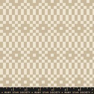 May include: A beige and cream fabric featuring a repeating geometric pattern of squares and rectangles. A black ruler at the bottom edge displays measurements from 1 to 7 inches, with the text "RUBY STAR SOCIETY" printed repeatedly.