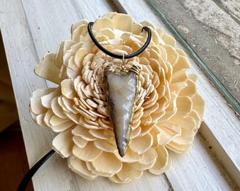 chalcedony arrowhead pendant backed with gold accent paint and wrapped in gold-filled wire