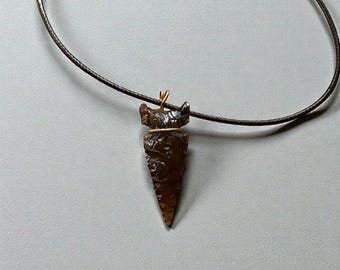 Translucent obsidian side-notched arrowhead wrapped in gold-filled wire