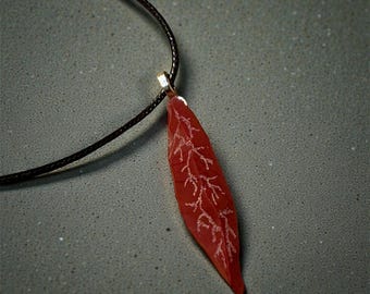 Red glass blade pendant with etched design